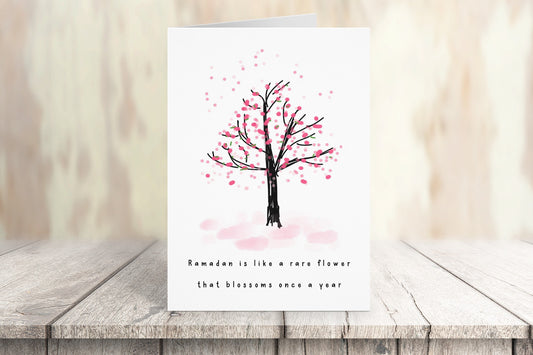 Ramadan Mubarak card with beautiful blossom tree design - Message on front is "Ramadan is like a rare flower that blossoms once a year" - Message inside - "Just as you begin to smell its fragrance, it disappears for another year, Ramadan Mubarak"